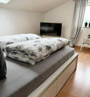 Ein Bett oder Betten in einem Zimmer der Unterkunft Refugium by Zirwick Apartment