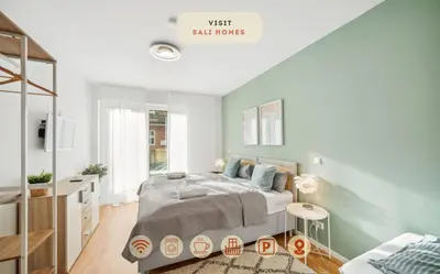Ein Bett oder Betten in einem Zimmer der Unterkunft Sali Homes R3 - Cozy Retreat by Roter Main River