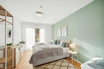 Ein Bett oder Betten in einem Zimmer der Unterkunft Sali Homes R3 - Cozy Retreat by Roter Main River