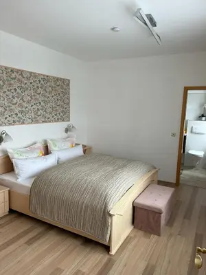 Ein Bett oder Betten in einem Zimmer der Unterkunft Vier Jahreszeiten Suite