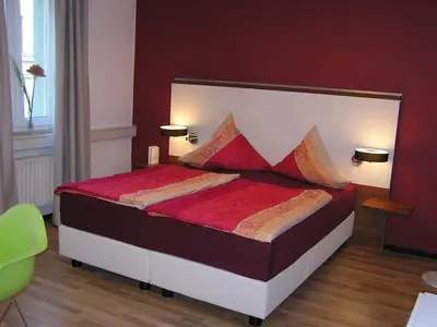 Ein Bett oder Betten in einem Zimmer der Unterkunft Auerbachs Keller