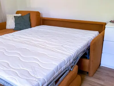 Ein Bett oder Betten in einem Zimmer der Unterkunft Kleines Glück zentral mit Balkon und Parkplatz
