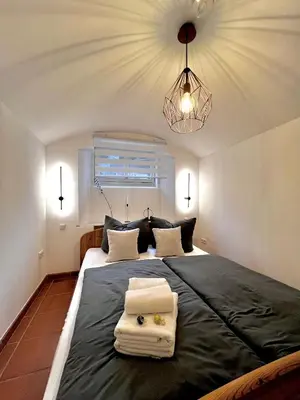 Ein Bett oder Betten in einem Zimmer der Unterkunft Apartment Elysium am Rosengarten