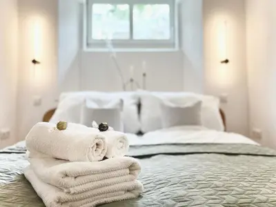 Ein Bett oder Betten in einem Zimmer der Unterkunft Apartment Elysium am Rosengarten