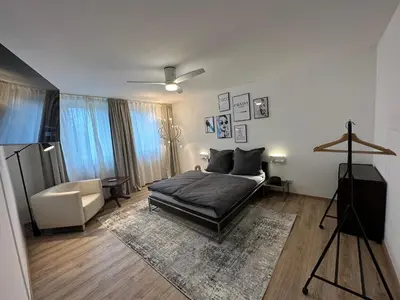 Ein Bett oder Betten in einem Zimmer der Unterkunft CityAppartLuxe am Hofgarten - zwischen Uni und Stadt-Zentrum