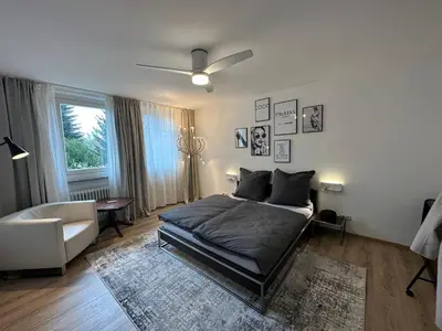 Ein Bett oder Betten in einem Zimmer der Unterkunft CityAppartLuxe am Hofgarten - zwischen Uni und Stadt-Zentrum