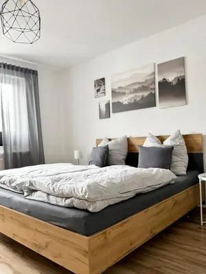 Ein Bett oder Betten in einem Zimmer der Unterkunft City Flair by Zirwick Apartment