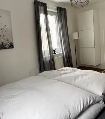 Ein Bett oder Betten in einem Zimmer der Unterkunft City Flair by Zirwick Apartment