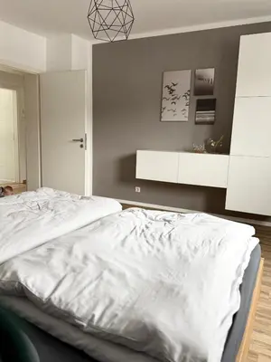 Ein Bett oder Betten in einem Zimmer der Unterkunft City Flair by Zirwick Apartment