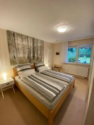 Ein Bett oder Betten in einem Zimmer der Unterkunft Eichendorff Garten Apartment, zentrumsnah, in direkter Nähe zur Universität