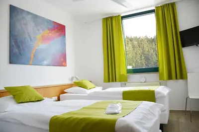 Ein Bett oder Betten in einem Zimmer der Unterkunft Motel Hirschberg