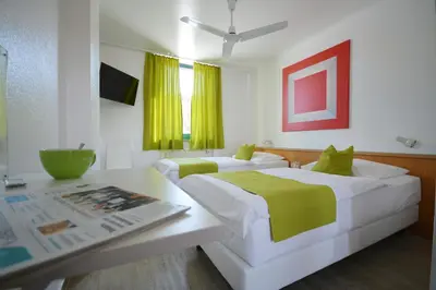 Ein Bett oder Betten in einem Zimmer der Unterkunft Motel Hirschberg