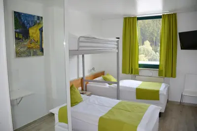 Ein Bett oder Betten in einem Zimmer der Unterkunft Motel Hirschberg