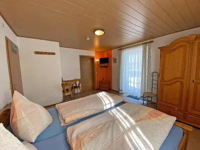 Ein Bett oder Betten in einem Zimmer der Unterkunft Kastanienhof