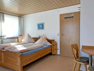 Ein Bett oder Betten in einem Zimmer der Unterkunft Kastanienhof
