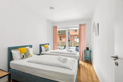 Ein Bett oder Betten in einem Zimmer der Unterkunft Salí Homes R4 - High-Quality Apartment with Terrace