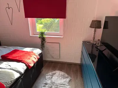 Ein Bett oder Betten in einem Zimmer der Unterkunft Frankenwald Ferienhaus FourStars am See in Lichtenberg, Bayern, Oberfranken, Bad Steben - Hof -Saale, Rennsteig