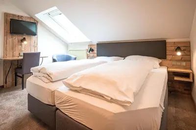 Ein Bett oder Betten in einem Zimmer der Unterkunft Landgasthof Thiem