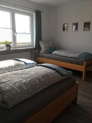 Ein Bett oder Betten in einem Zimmer der Unterkunft Ferienwohnung Auenthal