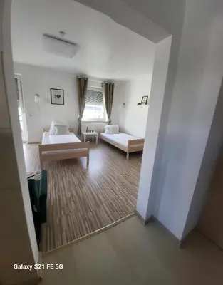 Ein Bett oder Betten in einem Zimmer der Unterkunft 80qm mit Balkon 3 getrennte Räume