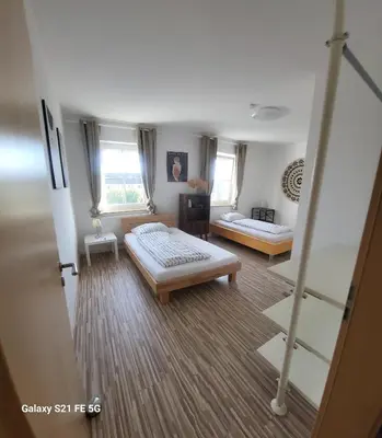 Ein Bett oder Betten in einem Zimmer der Unterkunft 80qm mit Balkon 3 getrennte Räume