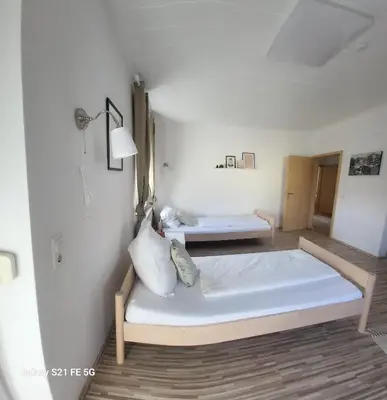 Ein Bett oder Betten in einem Zimmer der Unterkunft 80qm mit Balkon 3 getrennte Räume