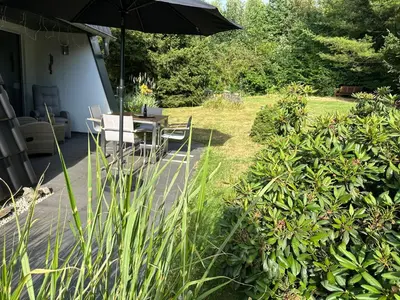 Ein Garten an der Unterkunft Komfortables Ferienhaus 80qm unweit vom See in Lichtenberg - Frankenwald - Bad Steben - Hof Saale