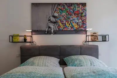Ein Bett oder Betten in einem Zimmer der Unterkunft CityHome Christopher CHC