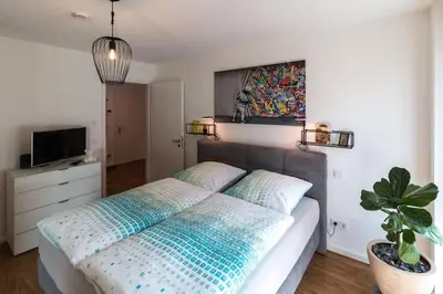 Ein Bett oder Betten in einem Zimmer der Unterkunft CityHome Christopher CHC