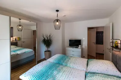 Ein Bett oder Betten in einem Zimmer der Unterkunft CityHome Christopher CHC