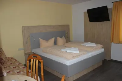 Ein Bett oder Betten in einem Zimmer der Unterkunft Landhotel Gasthof Zwota