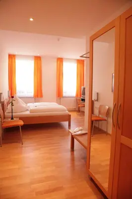 Ein Bett oder Betten in einem Zimmer der Unterkunft Gasthof Hotel Bauer