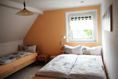 Ein Bett oder Betten in einem Zimmer der Unterkunft Ferienwohnung ELPIDA