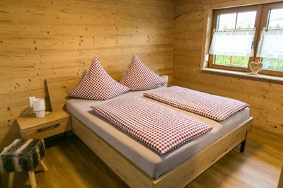 Ein Bett oder Betten in einem Zimmer der Unterkunft Chalet Hüttenzauber