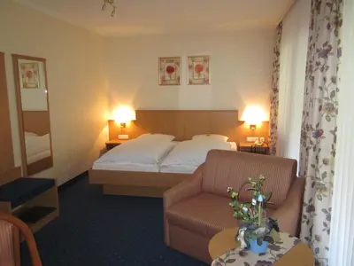 Ein Bett oder Betten in einem Zimmer der Unterkunft Gasthof Rodachtal mit Gästehaus Katharina