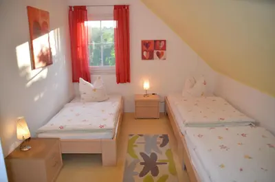 Ein Bett oder Betten in einem Zimmer der Unterkunft Ferienhäuser Schneeberger