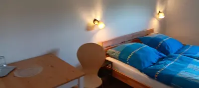 Ein Bett oder Betten in einem Zimmer der Unterkunft Haus Waldschänke