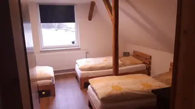 Ein Bett oder Betten in einem Zimmer der Unterkunft Haus Waldschänke