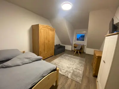 Ein Bett oder Betten in einem Zimmer der Unterkunft Colmdorf 14a Ferienhaus
