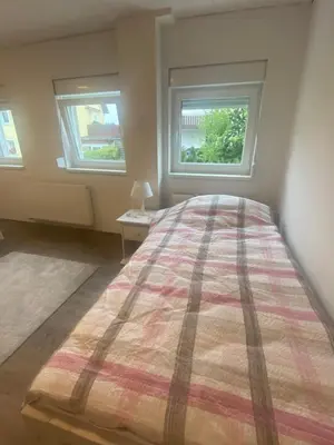 Ein Bett oder Betten in einem Zimmer der Unterkunft Colmdorf 14a Ferienhaus