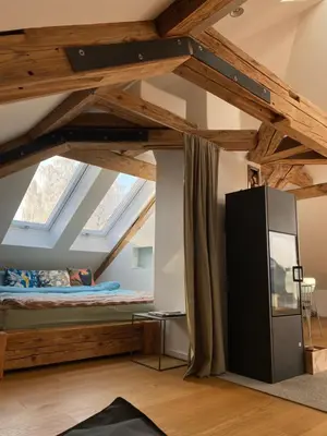 Ein Bett oder Betten in einem Zimmer der Unterkunft Loft im Haus mit Geschichte