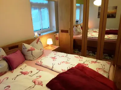 Ein Bett oder Betten in einem Zimmer der Unterkunft FeWo Ruhe-Insel Musikwinkel