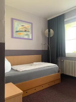 Ein Bett oder Betten in einem Zimmer der Unterkunft Hotel Carolaruh