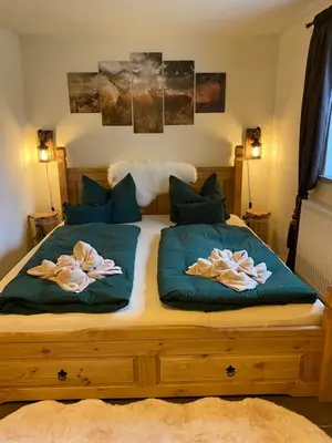Ein Bett oder Betten in einem Zimmer der Unterkunft Alpenranch