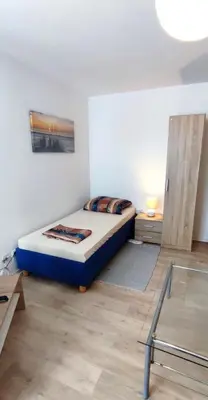 Ein Bett oder Betten in einem Zimmer der Unterkunft Zur Elster 1