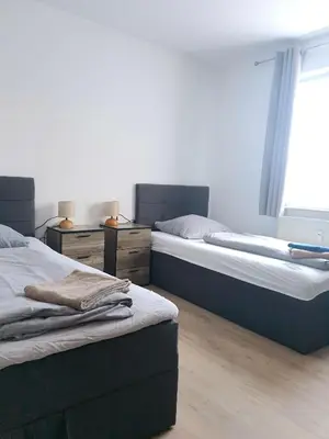 Ein Bett oder Betten in einem Zimmer der Unterkunft Zur Elster 2