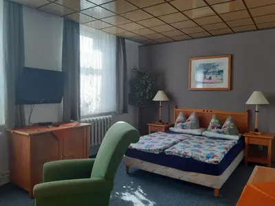 Ein Bett oder Betten in einem Zimmer der Unterkunft Hotel zur Post