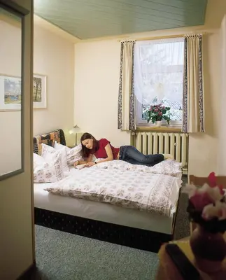 Ein Bett oder Betten in einem Zimmer der Unterkunft Hotel zur Post