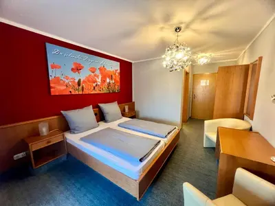 Ein Bett oder Betten in einem Zimmer der Unterkunft Hotel das rot