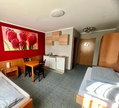 Ein Bett oder Betten in einem Zimmer der Unterkunft Hotel das rot